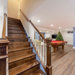 Basement Renovation - Rustic LVT, Stained Staircase